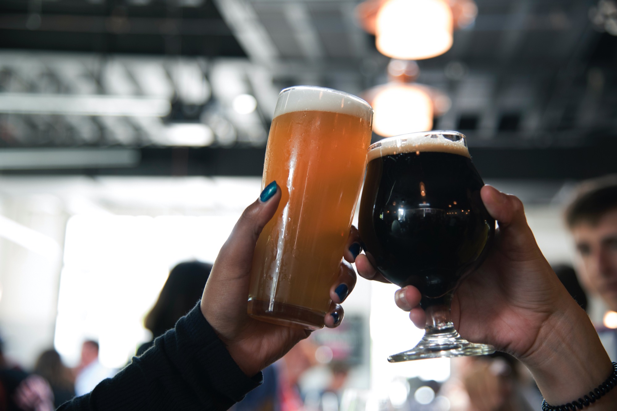 Two beers raised in a toast